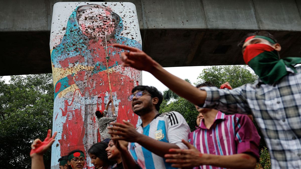 Protesters shout slogans as they vandalise a mural of Bangladesh's Sheikh Hasina with paint and mud, demanding her resignation at the University of Dhaka in Dhaka, Bangladesh, on August 3. Two days on, Hasina stepped down as PM and fled to India. File photo/Reuters Protesters shout slogans as they vandalise a mural of Bangladesh's Sheikh Hasina with paint and mud, demanding her resignation at the University of Dhaka in Dhaka, Bangladesh, on August 3. Two days on, Hasina stepped down as PM and fled to India. File photo/Reuters