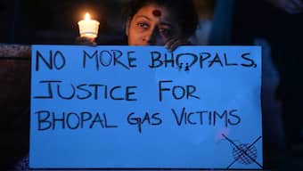 A woman takes part in a candlelight vigil to commemorate the anniversary of the Bhopal Gas disaster. It's been 40 years since poisonous gases escaped the Union Carbide plant in Bhopal, killing thousands and injuring many generations on. File image/AFP