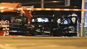 Forensics work on a damaged car sitting with its doors open after a driver plowed into a busy Christmas market in Magdeburg, Germany, early Saturday, Dec. 21, 2024. AP