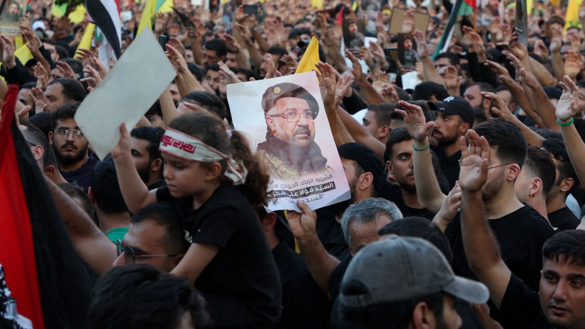 Mourners carry flags and a picture of Hezbollah senior commander Fuad Shukr, who was killed in an Israeli strike, during his funeral in Beirut's southern suburbs, Lebanon. Reuters Mourners carry flags and a picture of Hezbollah senior commander Fuad Shukr, who was killed in an Israeli strike, during his funeral in Beirut's southern suburbs, Lebanon. Reuters