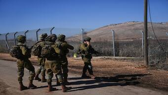 Israeli soldiers patrol the perimeter of the agricultural settlement of Avivim, next to the Lebanese border in upper Galilee, Israel, on Monday. AP