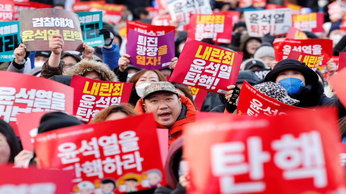 Protesters hold placards as they take part in a rally calling for the impeachment of South Korean President Yoon Suk Yeol, who declared martial law, which was reversed hours later, in front of the National Assembly in Seoul, South Korea. Yoon survived the vote. Reuters Protesters hold placards as they take part in a rally calling for the impeachment of South Korean President Yoon Suk Yeol, who declared martial law, which was reversed hours later, in front of the National Assembly in Seoul, South Korea. Yoon survived the vote. Reuters