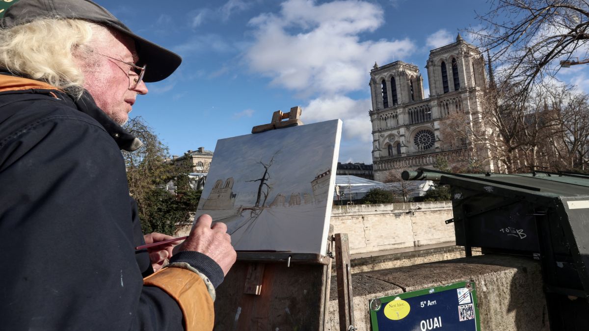 An artist paints a view of Notre-Dame de Paris cathedral, in front of the cathedral a few days before its reopening, in Paris. The Notre-Dame Cathedral is set to re-open with ceremonies on December 7 and 8, 2024, five years after the 2019 fire which ravaged the world heritage landmark and toppled its spire. AFP An artist paints a view of Notre-Dame de Paris cathedral, in front of the cathedral a few days before its reopening, in Paris. The Notre-Dame Cathedral is set to re-open with ceremonies on December 7 and 8, 2024, five years after the 2019 fire which ravaged the world heritage landmark and toppled its spire. AFP