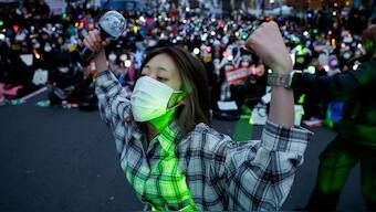 A protester dances, during a rally calling for the impeachment of South Korean President Yoon Suk Yeol in Seoul. Reuters