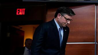 US House Speaker Mike Johnson arrives to speak to reporters after the US House of Representatives rejected a Republican-led funding bill aimed at averting the closure. Reuters