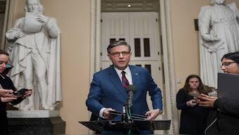 Speaker of the House Mike Johnson, R-La., talks briefly to reporters just before a vote on an interim spending bill to prevent a government shutdown, at the Capitol in Washington, Thursday. AP File