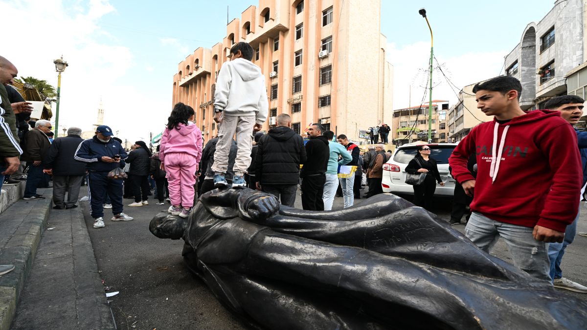 Children step on a toppled statue of former president Hafez al-Assad as people gather on a street in Sweida on December 13, to celebrate the collapse of his son Bashar al-Assad's rule. Islamist-led rebels took Damascus in a lightning offensive on December 8, ousting president Bashar al-Assad and ending five decades of Baath rule in Syria. AFP/Representational image Children step on a toppled statue of former president Hafez al-Assad as people gather on a street in Sweida on December 13, to celebrate the collapse of his son Bashar al-Assad's rule. Islamist-led rebels took Damascus in a lightning offensive on December 8, ousting president Bashar al-Assad and ending five decades of Baath rule in Syria. AFP/Representational image