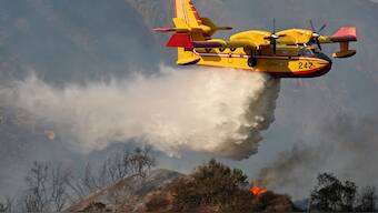 Two Canadian 'Super Scoopers' have made flights and dozens of repeated water drops to fight the fire in Palisades. Reuters