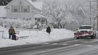 People use shovels and snow blowers to clear snow during the first winter storm of 2024 which is expected to bring heavy snowfall across the northeast United States, in Grafton, Massachusetts, US. Reuters