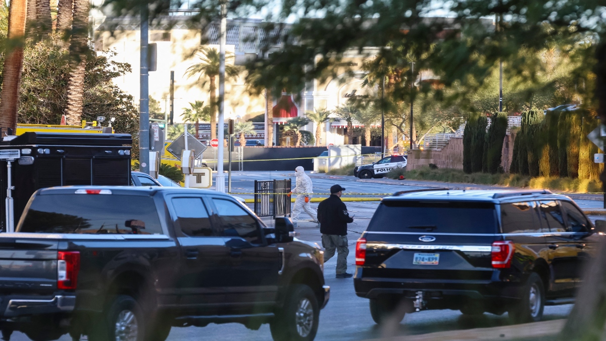 Investigators work at the scene where a Tesla Cybertruck exploded outside the lobby of President-elect Donald Trump's hotel on January 1, 2025, in Las Vegas. AFP Investigators work at the scene where a Tesla Cybertruck exploded outside the lobby of President-elect Donald Trump's hotel on January 1, 2025, in Las Vegas. AFP