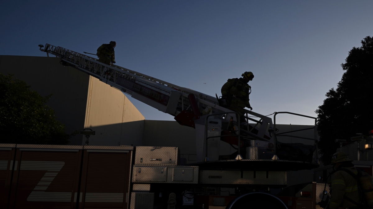 Firefighter walk down a ladder outside a building where a plane crash occurred Thursday, Jan. 2, 2025, in Fullerton, Calif. (AP Photo/Kyusung Gong) Firefighter walk down a ladder outside a building where a plane crash occurred Thursday, Jan. 2, 2025, in Fullerton, Calif. (AP Photo/Kyusung Gong)