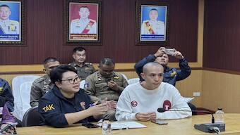In this image provided by the Royal Thai Police, Chinese actor Wang Xing, right, talks with Thai police officers in Mae Sot district, in Thai-Myanmar border, Tak province Tuesday, Jan. 7, 2025. AP 