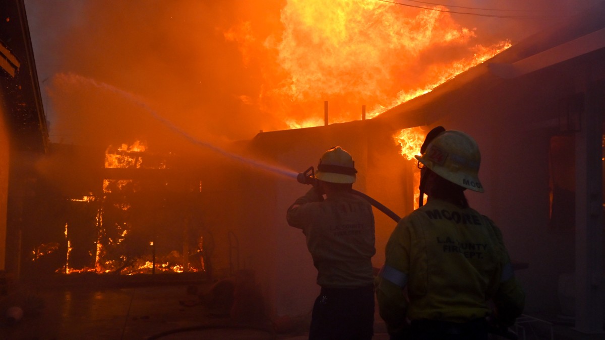 Firefighters battle the Eaton Fire as it engulfs structures Wednesday, January 8, 2025 in Altadena, California. AP Firefighters battle the Eaton Fire as it engulfs structures Wednesday, January 8, 2025 in Altadena, California. AP