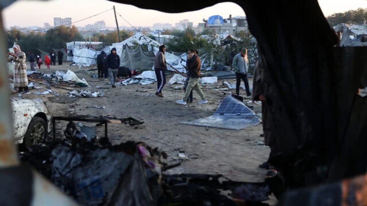 Palestinians walk amid scattered debris of tents on Thursday following an overnight Israeli strike on a makeshift displacement camp in al-Mawasi in the southern Gaza Strip. File image/AFP Palestinians walk amid scattered debris of tents on Thursday following an overnight Israeli strike on a makeshift displacement camp in al-Mawasi in the southern Gaza Strip. File image/AFP
