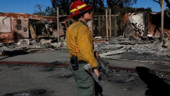 A first responder looks on, as the Eaton Fire continues, in Altadena, California, US, on Monday. Reuters