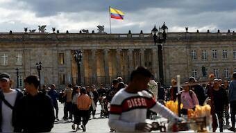 People walk at Plaza Bolivar on the day US President Donald Trump announced to impose tariffs and sanctions after Colombian President Gustavo Petro refused to allow flights with deported Colombians to enter the country, in Bogota, Colombia, January 26, 2025. File Image/Reuters