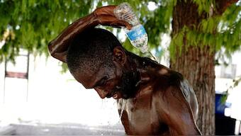 A homeless man pours water over himself during an excessive heat warning in Oklahoma City, Oklahoma, US. Source: Reuters. 