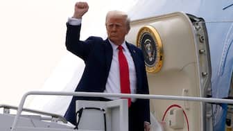 US President Donald Trump gestures as he boards Air Force One en route to Florida at Harry Reid International Airport in Las Vegas on January 25, 2025. AP