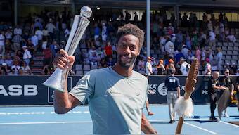 France's Gael Monfils celebrates with the trophy after defeating Belgium's Zizou Bergs in the final of the ASB Classic in Auckland. AP