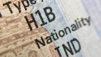 Tech firms such as Google, Amazon and Microsoft are warning employees on H1-B visas not to leave America 