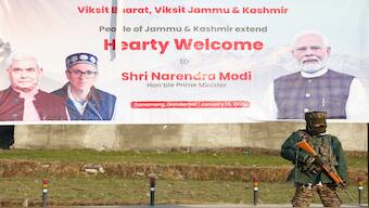 A security personnel stands guard near a billboard during the inauguration of the Z-Morh tunnel project by Prime Minister Narendra Modi, in central Kashmir's Ganderbal district on Monday. Reuters