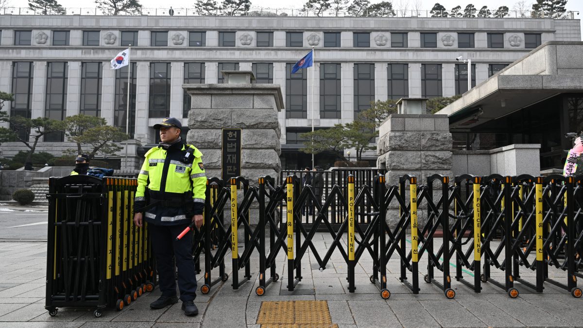 A police officer stands guard in front of the Constitutional Court in Seoul on January 14, 2025, as the court begins the first formal hearing of the impeachment trial of South Korean President Yoon Suk Yeol. AFP A police officer stands guard in front of the Constitutional Court in Seoul on January 14, 2025, as the court begins the first formal hearing of the impeachment trial of South Korean President Yoon Suk Yeol. AFP