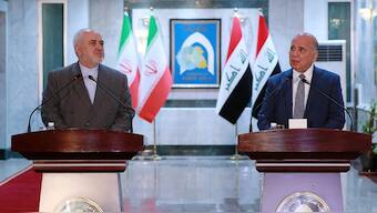 Iraqi foreign minister Fouad Hussein (R) and his Iranian counterpart Mohammad Javad hold a news conference. File image/AP