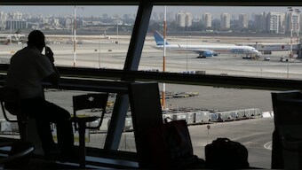 A passenger looks out of a window at Ben Gurion International airport. Representational image. Reuters