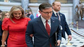 Speaker of the House Mike Johnson, R-La., accompanied by his wife Kelly Johnson, left, walks to the House Chamber before starting the 119th United States Congress at the Capitol in Washington, on Friday. AP 