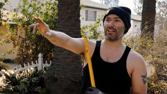 Tristin Perez chose not to evacuate, but try to save his property from burning down. Reuters