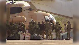 This undated photograph released in April 2022 by France’s military shows Russian mercenaries boarding a helicopter in northern Mali. AP