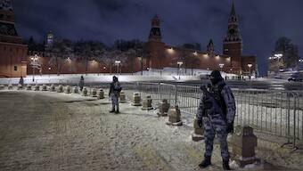 Servicemen of Rosguardia (National Guard) guard an area near Red Square prior to celebrating the New Year's Day, in Moscow, Russia. AP