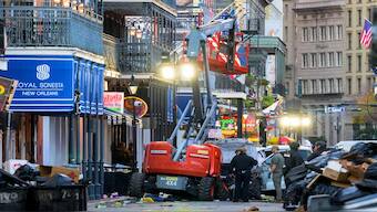 Police investigators surround a white truck that has been crashed into a work lift in the French Quarter of New Orleans, Louisiana, on Wednesday. AFP