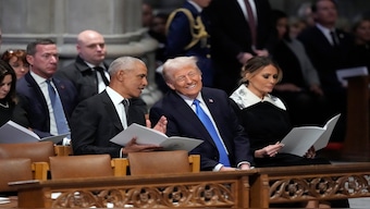 Former President Barack Obama talks with President-elect Donald Trump, next to Melania Trump, as they arrive to attend the state funeral for former president Jimmy Carter at Washington National Cathedral in Washington, on Thursday. AP 
