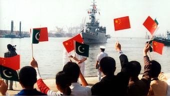 (File) Officials wave flags as a Chinese naval ship arrives at PNS Dockyard in Karachi in this handout picture released by the Pakistan Navy on March 5, 2007. Reuters