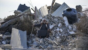 Atiya Abu Sheiban sits on the ruins of his destroyed home, days after the ceasefire deal between Israel and Hamas, in Rafah, southern Gaza Strip. AP
