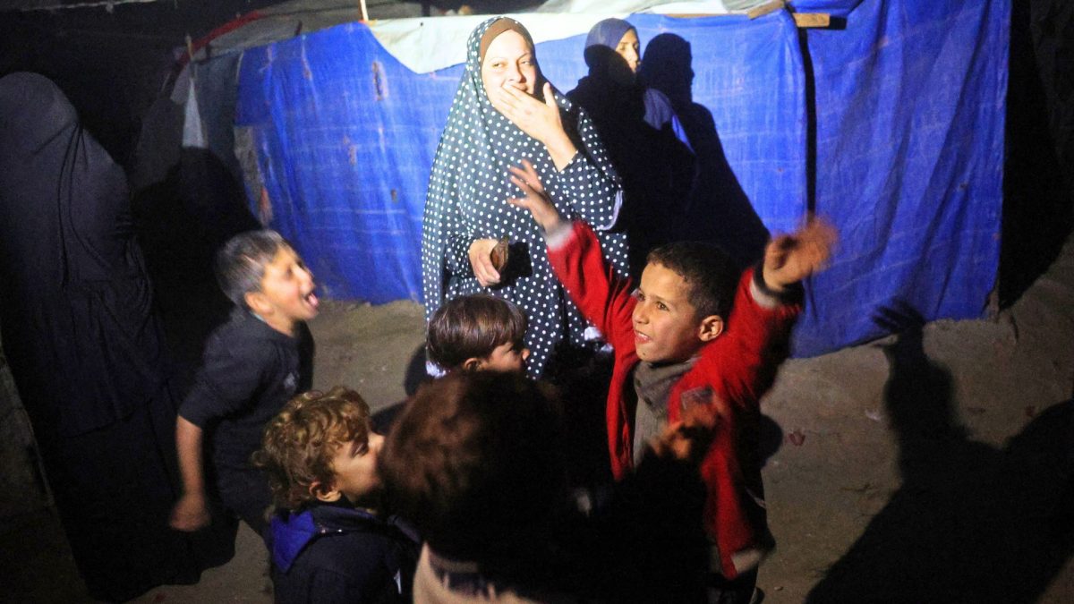 Palestinians celebrate at their camp for people displaced by conflict at Deir el-Balah in the central Gaza Strip, on January 15, 2025. AFP Palestinians celebrate at their camp for people displaced by conflict at Deir el-Balah in the central Gaza Strip, on January 15, 2025. AFP