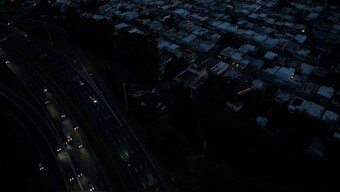 A drone view shows cars driving on a highway as Puerto Ricans were without electricity early on New Year's Eve after a grid failure left nearly all of the island without power, in San Juan, Puerto Rico. Reuters