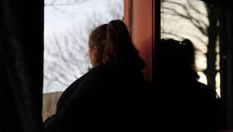 A woman poses at her home in England, Britain, January 8, 2025. She was 14 when she was sexually abused by a grooming gang in Rochdale. REUTERS/Hollie Adams 