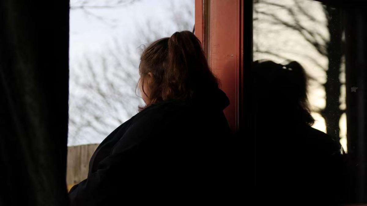 A woman poses at her home in England, Britain, January 8, 2025. She was 14 when she was sexually abused by a grooming gang in Rochdale. REUTERS/Hollie Adams A woman poses at her home in England, Britain, January 8, 2025. She was 14 when she was sexually abused by a grooming gang in Rochdale. REUTERS/Hollie Adams