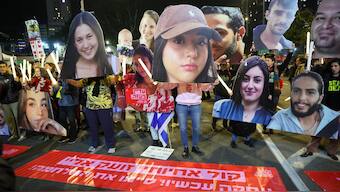 Protesters hold cutout portraits of hostages held captive in Gaza by Palestinian militants since the October 7 attacks, during a demonstration calling for action to secure their release, outside the Defence Ministry headquarters in Tel Aviv on January 4, 2025 amid the ongoing war in the Palestinian territory between Israel and Hamas. Image- AFP