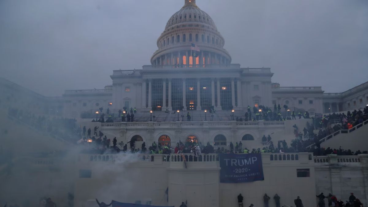 Police officers stand guard as supporters of President Trump gather in front of the Capitol Building. File Image- Reuters Police officers stand guard as supporters of President Trump gather in front of the Capitol Building. File Image- Reuters