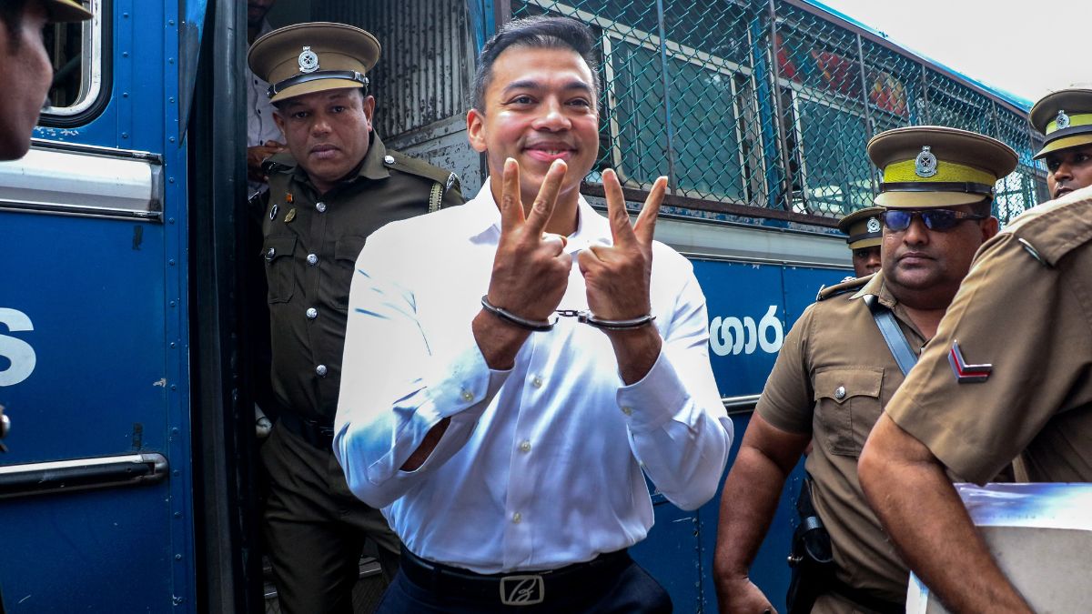 Police escort Yoshitha Rajapaksa (C), former junior naval officer and son of Sri Lanka's former president Mahinda Rajapaksa, to a court in Colombo on January 27, 2025. Image- AFP Police escort Yoshitha Rajapaksa (C), former junior naval officer and son of Sri Lanka's former president Mahinda Rajapaksa, to a court in Colombo on January 27, 2025. Image- AFP