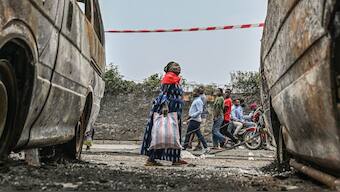 Residents walk by charred vehicles in Goma, Democratic republic of the Congo, Friday, Jan. 31, 2025. Image- AP