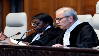 Judge and President of the International Court of Justice (ICJ) Nawaf Salam (R) delivers a non-binding ruling on the legal consequences of the Israeli occupation of the West Bank and East Jerusalem at the ICJ in The Hague on July 19, 2024. AFP File
