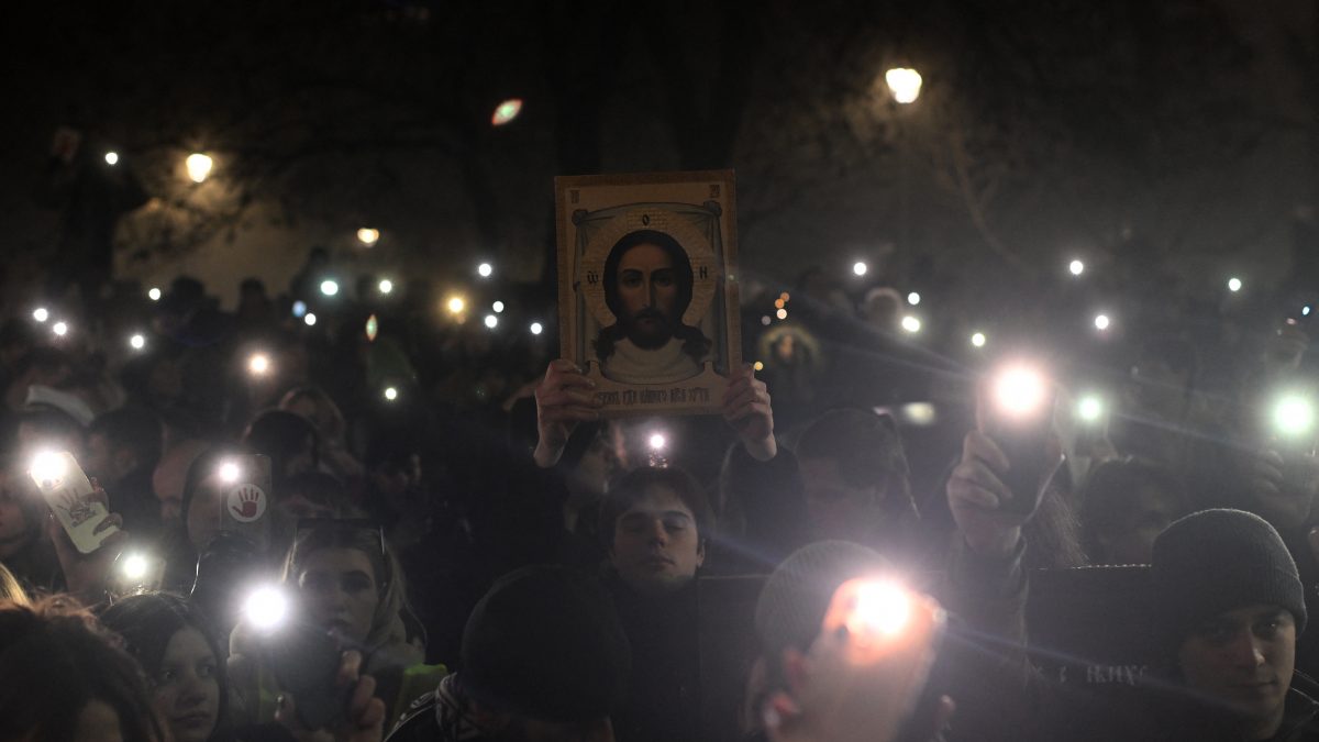 A protestor holds an orthodox icon as a thousands of students attend a protest on New Year's Eve to demand accountability for the November train station roof collapse that killed 15 people in Belgrade, Serbia. AFP A protestor holds an orthodox icon as a thousands of students attend a protest on New Year's Eve to demand accountability for the November train station roof collapse that killed 15 people in Belgrade, Serbia. AFP