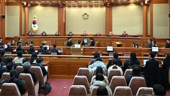South Korea Constitutional Court Judges attend the first formal hearing of the impeachment trial of suspended South Korean President Yoon Suk Yeol at the Constitutional Court in Seoul on January 14, 2025. Source: AFP. 
