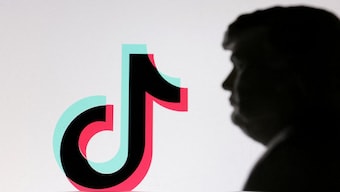 A 3D-printed miniature model of U.S. PresidentDonald Trump and TikTok logo are seen in this illustration. File image/ Reuters