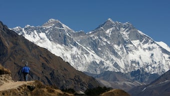 A tourist looks at a view of Mt. Everest from the hills of Syangboche in Nepal. Reuters
