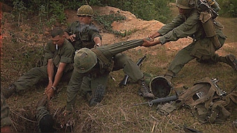 U.S. soldiers lower a member of their reconnaissance platoon into a Viet Cong tunnel during a search and destroy mission in Vietnam, April 24, 1967. File image/Reuters